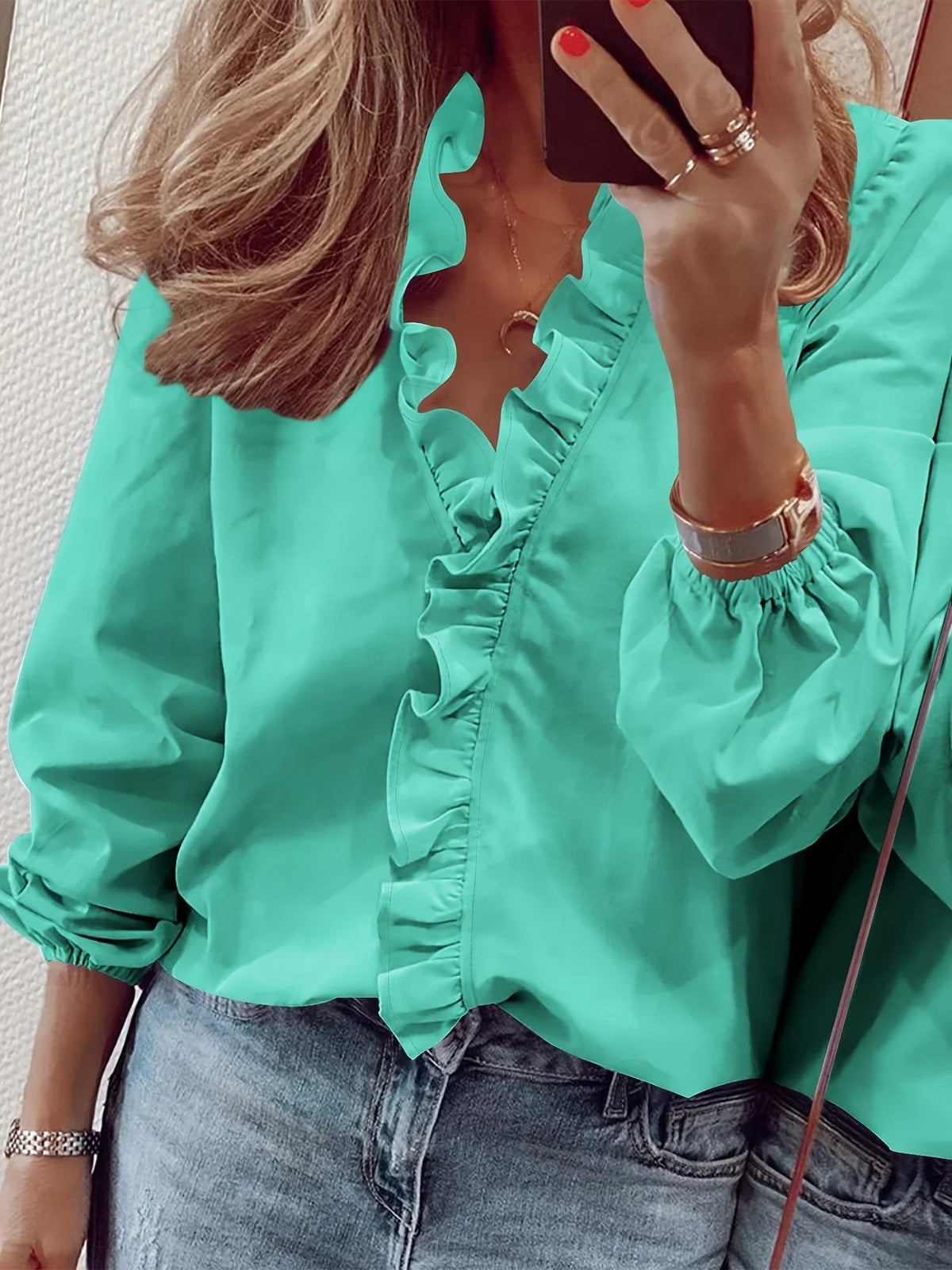 Vittoria · Blusa refinada con volantes
