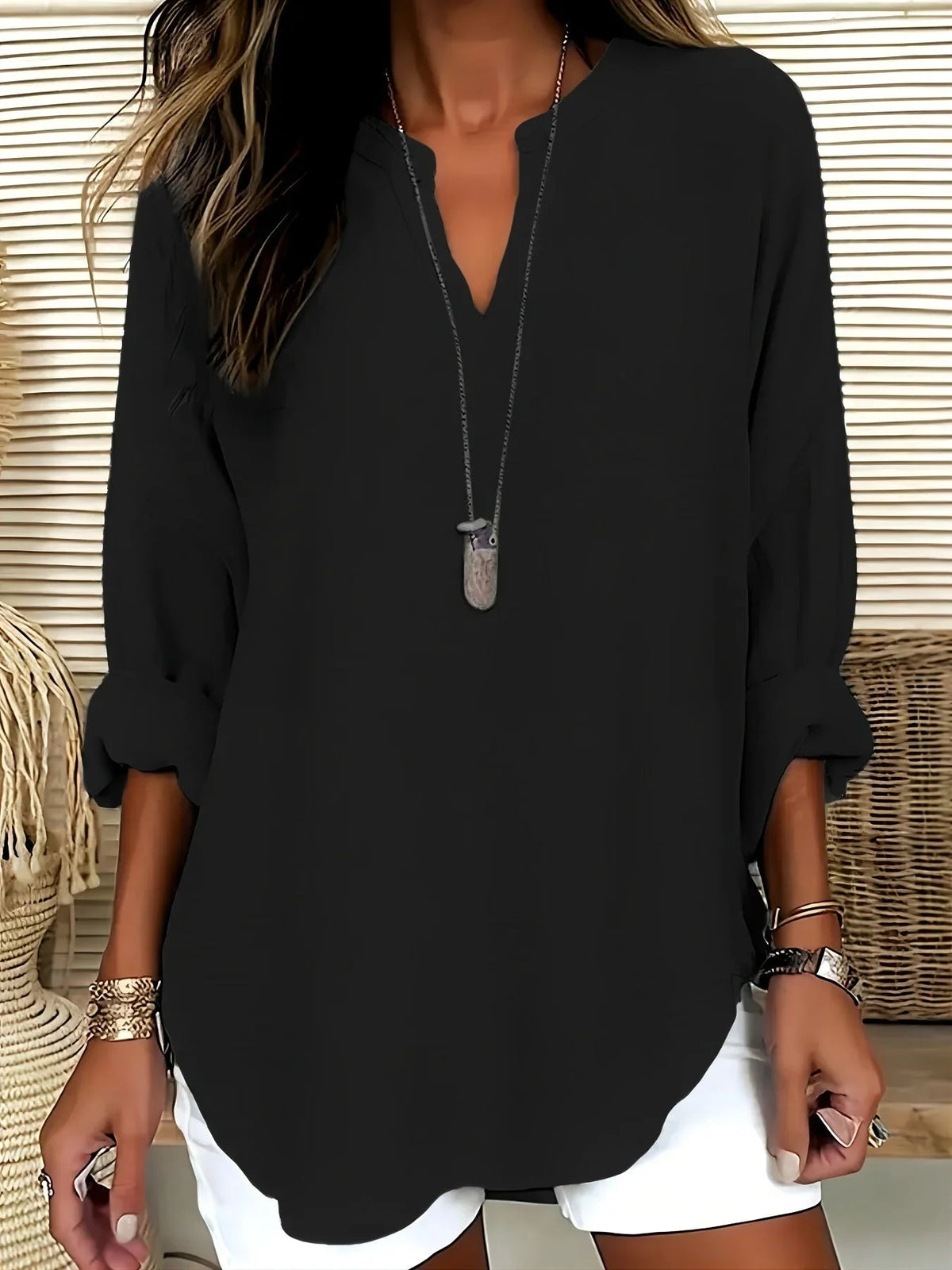 Ines · Blusa de cuello en V en tejido ligero