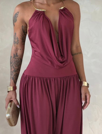 Vestido Gioia. Una elegancia atemporal encerrada en una silueta fluida y sensual. El mono drapeado está pensado para la mujer que sabe cómo captar todas las miradas sin esfuerzo.