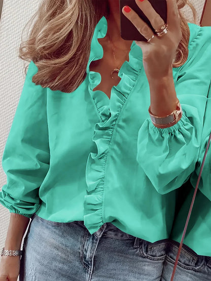 Vittoria · Blusa refinada con volantes