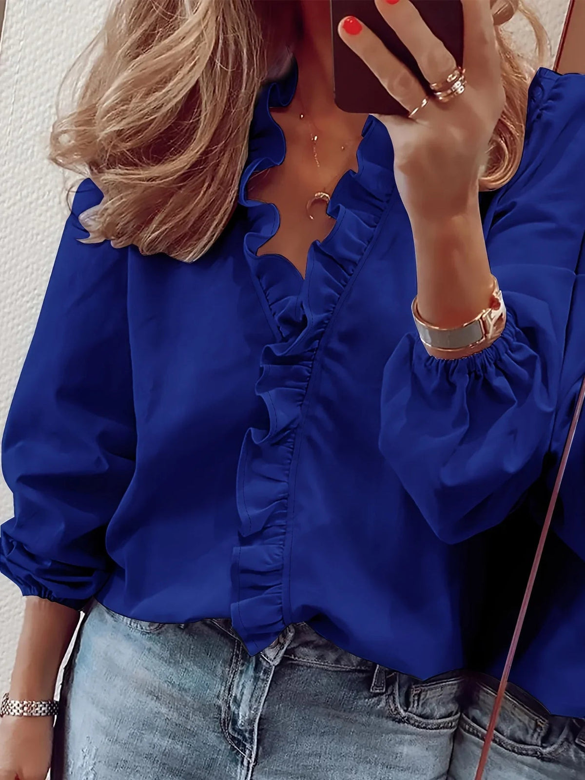 Vittoria · Blusa refinada con volantes